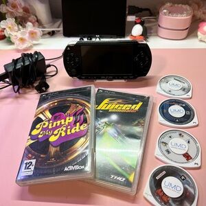 Sony PSP 1000 with games, charger, and 64 gb sd card loaded with games